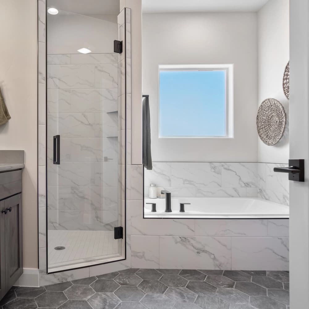 A modern minimalist room with a white loveseat on a grey vinyl floor