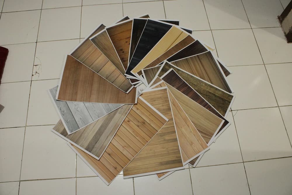 pictures of different flooring options arranged in a circle on a tile floor