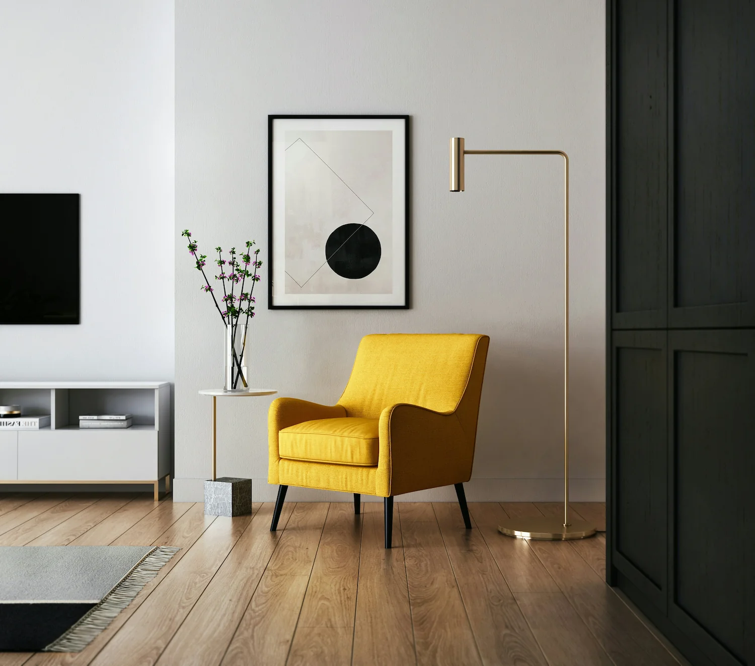 A modern room with a yellow chair in the center standing on beautiful wood floors.